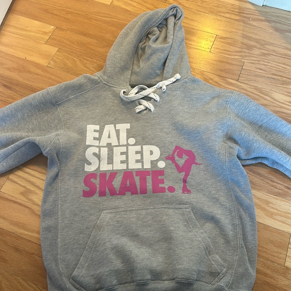 Gray hoodie skating "Eat. Sleep. Skate."